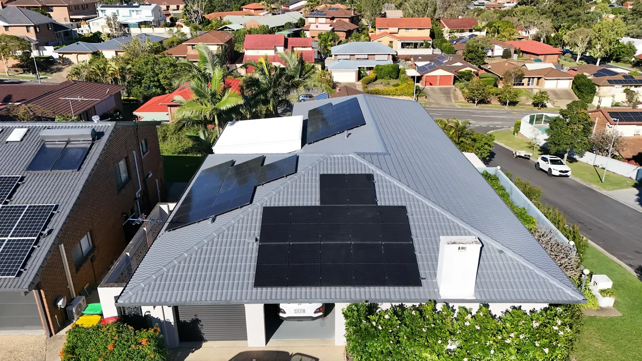 Freshly recoated charcoal tile roof with solar panels